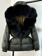 Women's long puffer jacket with fur hood - lifestyle photo